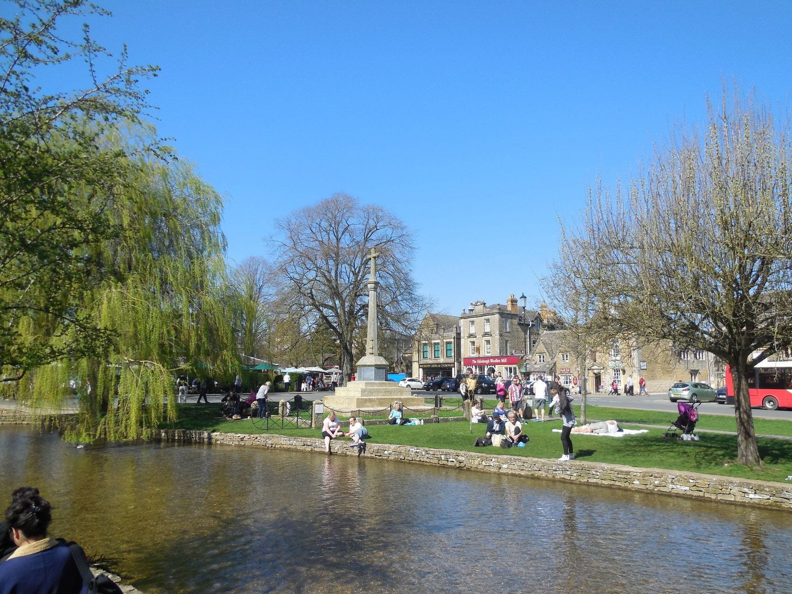 Bourton-on-the-Water village centre with the River Windrush and war memorial