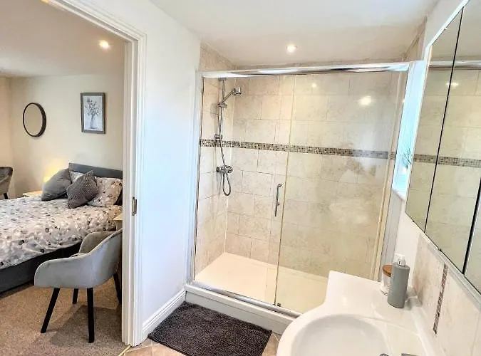 En-suite bathroom with walk-in shower and basin