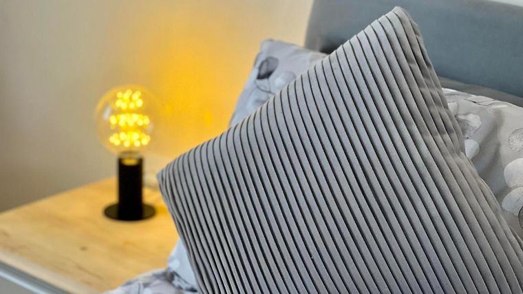 Cushion and bedside lamp