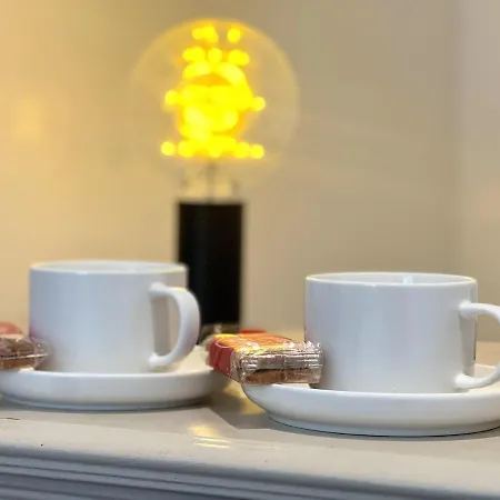 Tea and coffee tray with biscuits in the guest room