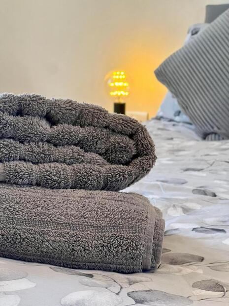 Folded towels on the bed